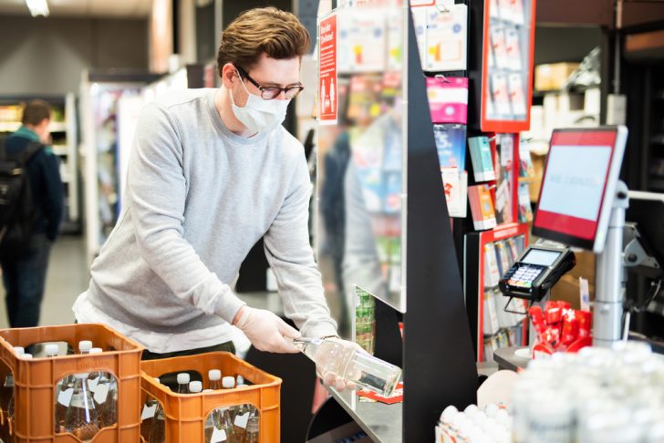 supermarket-cashier-with-food-and-facial-mask