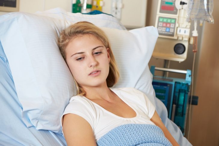 teenager-in-hospital-bed seeming depressed